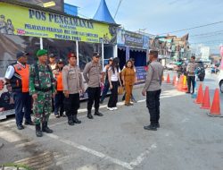 Babinsa Perkuat Pengamanan Arus Mudik Lebaran di Pos Pam Laguboti 