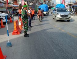 Babinsa Siaga Pengamanan Arus Mudik Lebaran di Pos Pam di Laguboti 